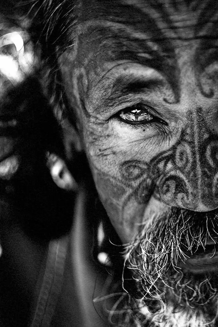 Extreme close-up of an elder's eye and cheek, marked with traditional Māori tā moko